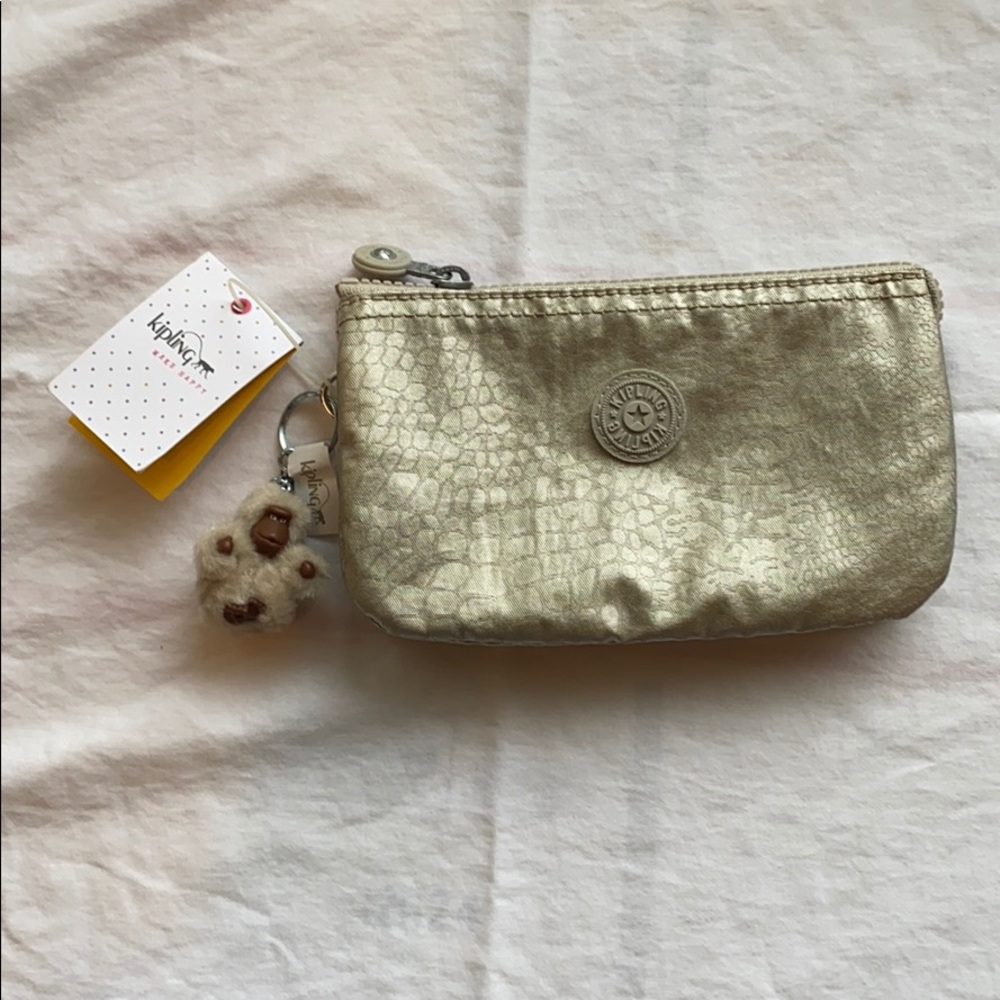 Kipling Silver Beige Handbag with 5 pouches